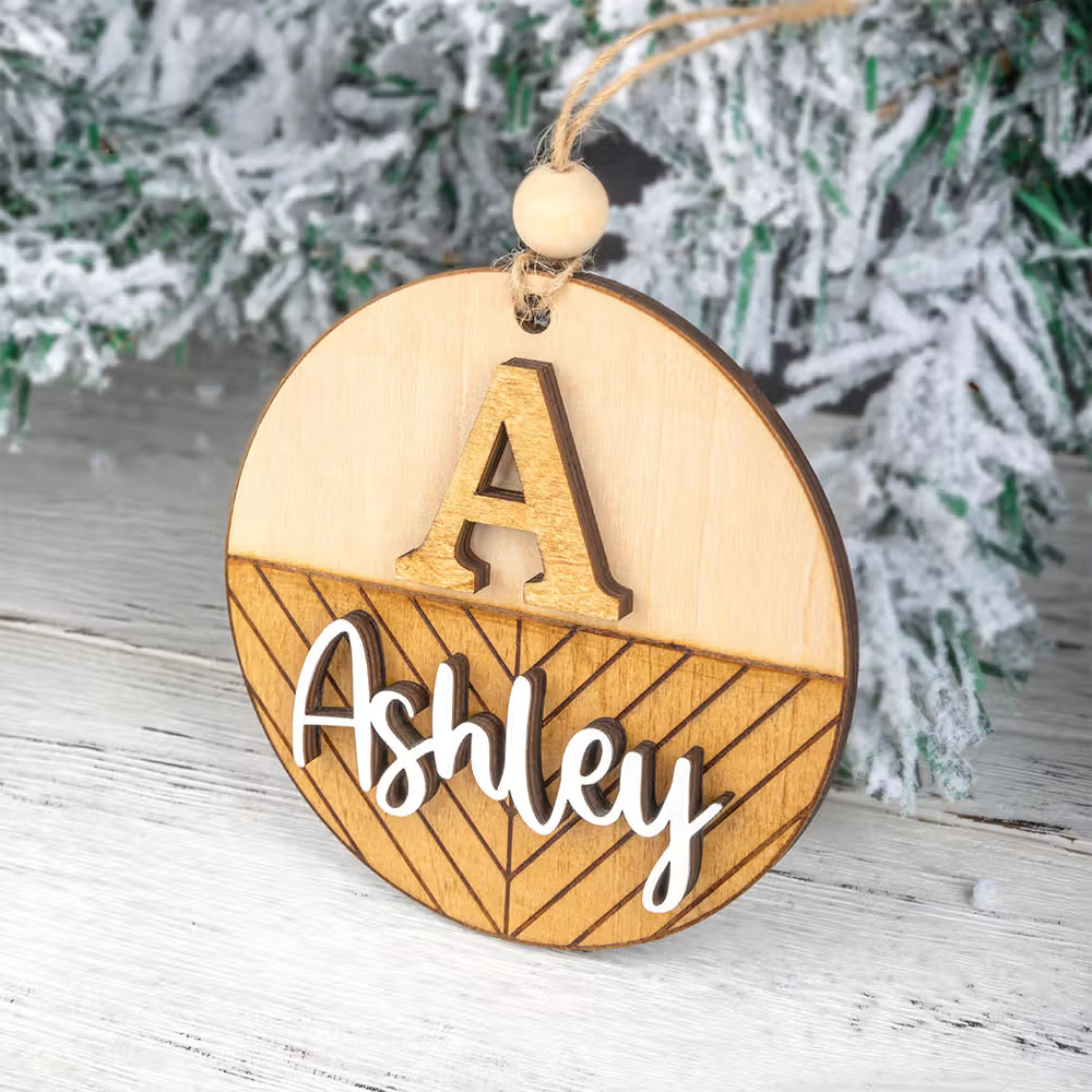 wooden ornament with a cut-out name and a letter A